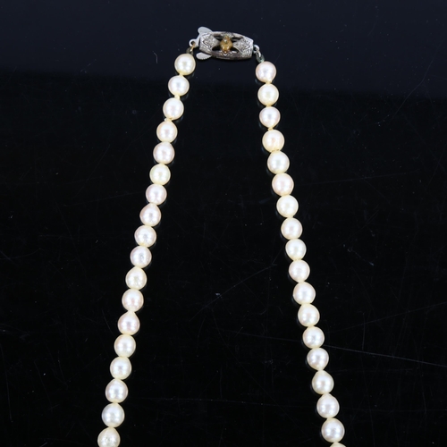 464 - MIKIMOTO - a single strand cultured pearl necklace with silver clasp, bead diameter 11mm, necklace l... 