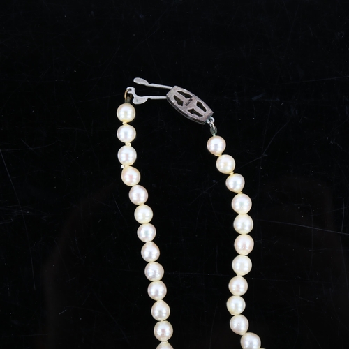 464 - MIKIMOTO - a single strand cultured pearl necklace with silver clasp, bead diameter 11mm, necklace l... 