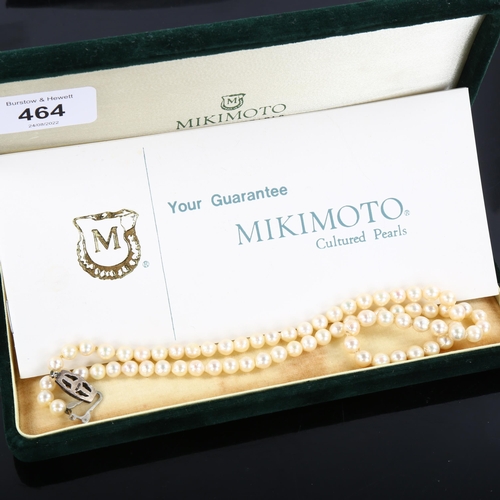 464 - MIKIMOTO - a single strand cultured pearl necklace with silver clasp, bead diameter 11mm, necklace l... 