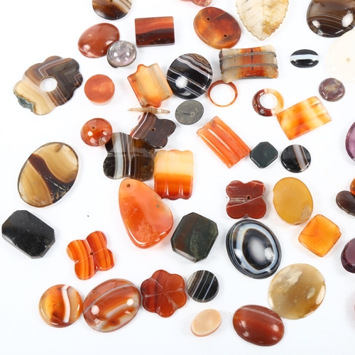 486 - A quantity of loose gemstones and jewellery findings, including banded agate jasper etc