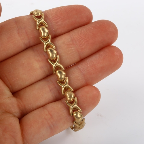 490 - A 9ct gold heart and cross bracelet, length 18cm, 4.1g