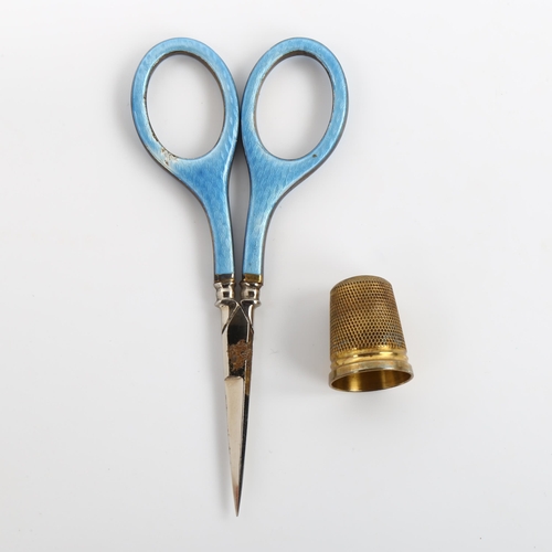 500 - A leather-cased 2-piece silver and blue enamel sewing set, comprising scissors and thimble, size 8, ... 