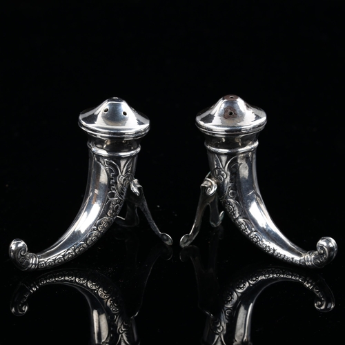 511 - A pair of Norwegian silver cornucopia pepperettes, with Viking helmet decoration, Swedish import mar... 