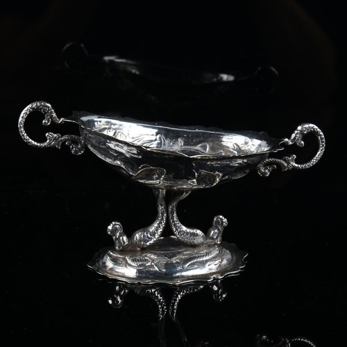 513 - A 19th century Spanish silver pedestal table salt, with relief embossed fish decoration and mermaid ... 