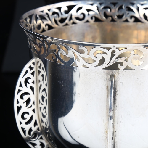 514 - A heavy Victorian silver rocket table centre bowl, with flared rim and pierced foliate gallery with ... 