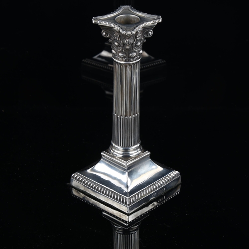 522 - An Edwardian silver Corinthian column table candlestick, with removeable sconce, by Goldsmiths & Sil... 