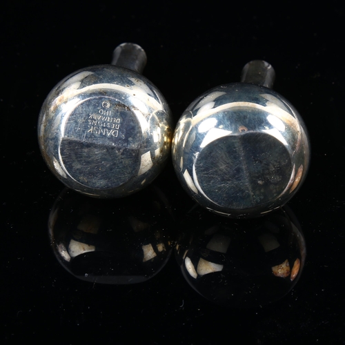 523 - QUISTGAARD for DANSK DESIGNS - a pair of Danish silver plated leaning onion candle taper stick holde... 