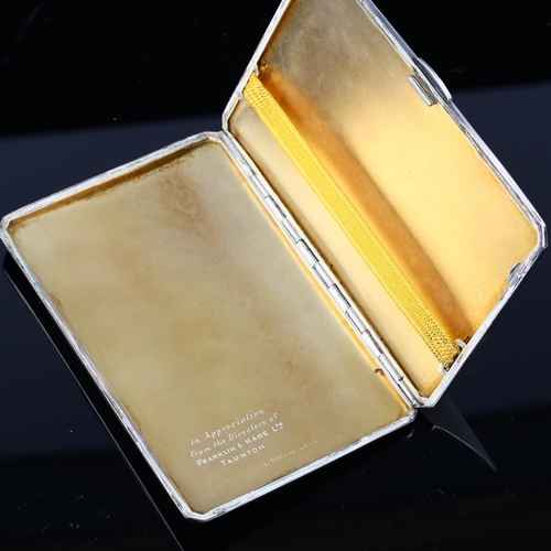 530 - A George VI silver cigarette case, allover engine turned decoration with gilt interior, by E J Trevi... 