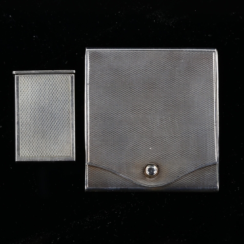 534 - A German silver matchbook holder, and a miniature Danish silver pillbox, both with engine turned dec... 