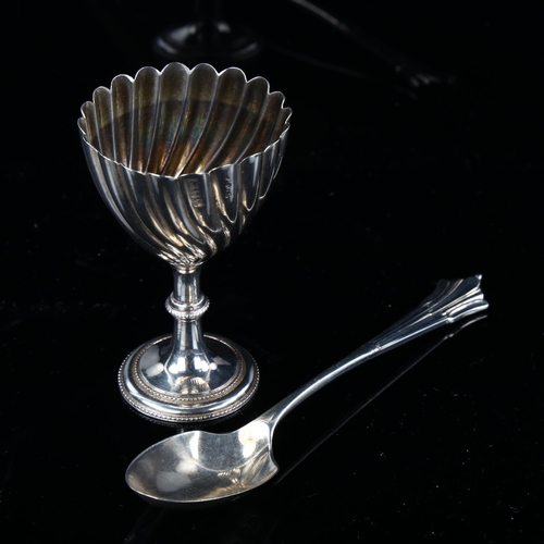 537 - A Victorian silver egg cup and spoon set, twisted fluted decoration, indistinct maker's marks, hallm... 