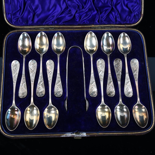 550 - A cased set of 12 Victorian Aesthetic Movement silver teaspoons and pair of sugar tongs, with relief... 