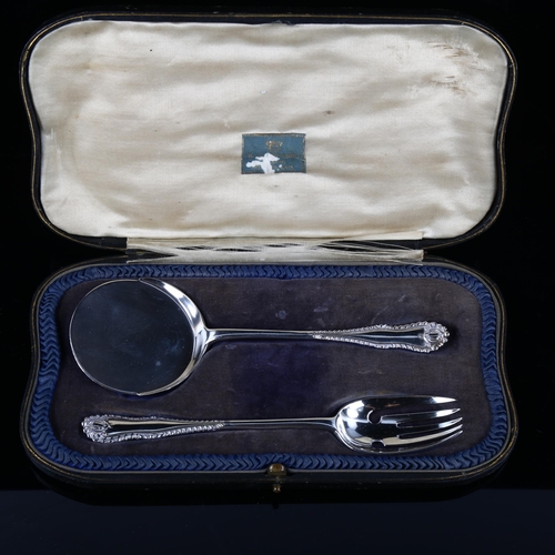 553 - A George V silver 2-piece serving set, comprising slice and fork, by Josiah Williams & Co, hallmarks... 