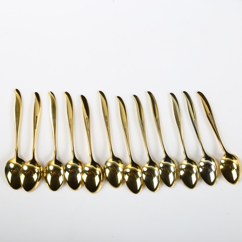 557 - ABSA - a set of 12 Danish vermeil sterling silver and harlequin enamel coffee spoons, length 9cm