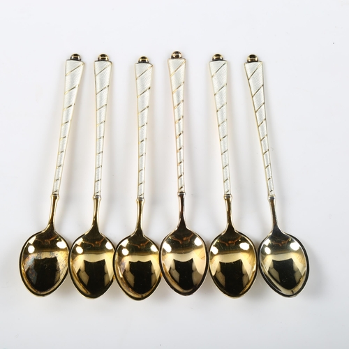 559 - EGON LAURIDSEN - a set of 6 Danish vermeil sterling silver and white enamel coffee spoons, length 9.... 