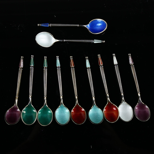 560 - ANTON MICHELSEN - a set of 11 Danish vermeil sterling silver and harlequin enamel coffee spoons, wit... 