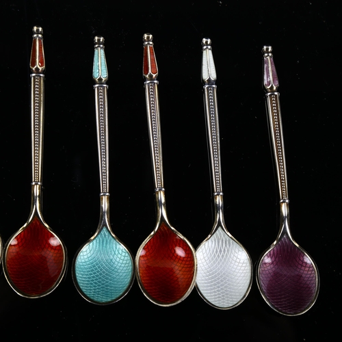 560 - ANTON MICHELSEN - a set of 11 Danish vermeil sterling silver and harlequin enamel coffee spoons, wit... 