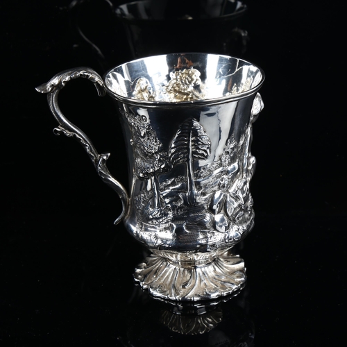 581 - A Victorian silver pedestal mug, high relief embossed decoration depicting boy with animals, by Thom... 