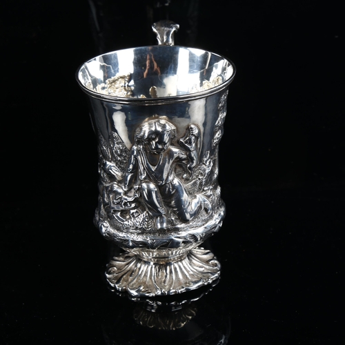 581 - A Victorian silver pedestal mug, high relief embossed decoration depicting boy with animals, by Thom... 