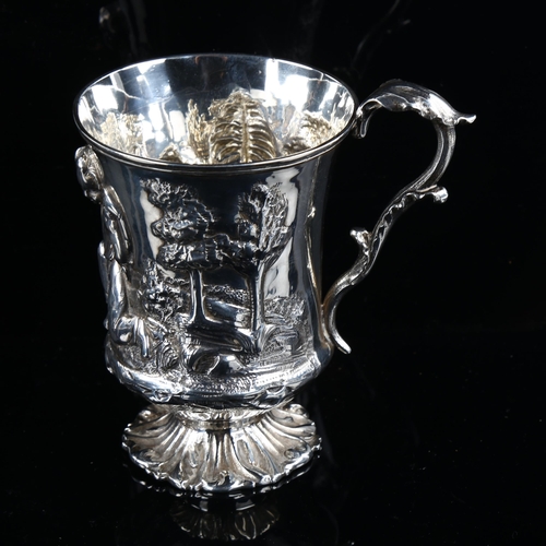 581 - A Victorian silver pedestal mug, high relief embossed decoration depicting boy with animals, by Thom... 