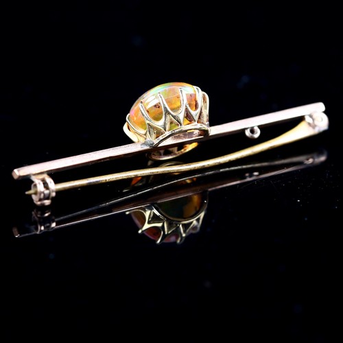 192 - An Antique 9ct rose gold fire opal bar brooch, set with round cabochon fire opal, opal measures: 10.... 