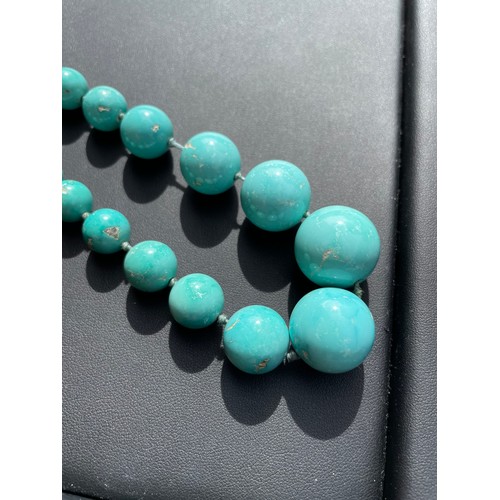 148 - An Antique graduated turquoise bead necklace, on individually knotted string on French gold-mounted ... 