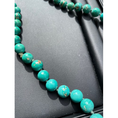 148 - An Antique graduated turquoise bead necklace, on individually knotted string on French gold-mounted ... 