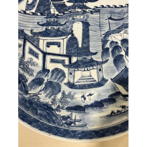 1142 - A Chinese blue and white porcelain charger, with hand painted palace fortifications, diameter 37cm