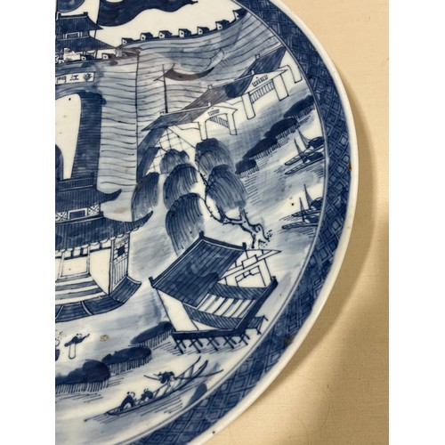 1142 - A Chinese blue and white porcelain charger, with hand painted palace fortifications, diameter 37cm