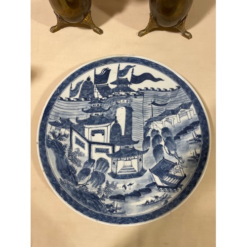 1142 - A Chinese blue and white porcelain charger, with hand painted palace fortifications, diameter 37cm