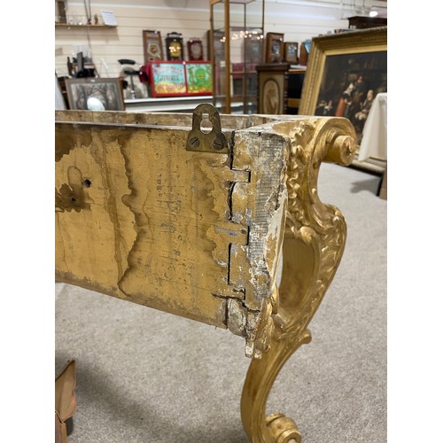 1020 - A 19th century French Rococo style console table, carved and scrolled giltwood frame with original m... 