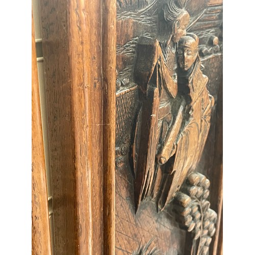 1117 - A pair of Chinese relief carved hardwood panels, 50cm x 20cm