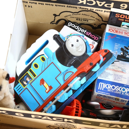 520 - A box of various toys and games, including a Thomas The Tank Engine carry case with various locomoti... 