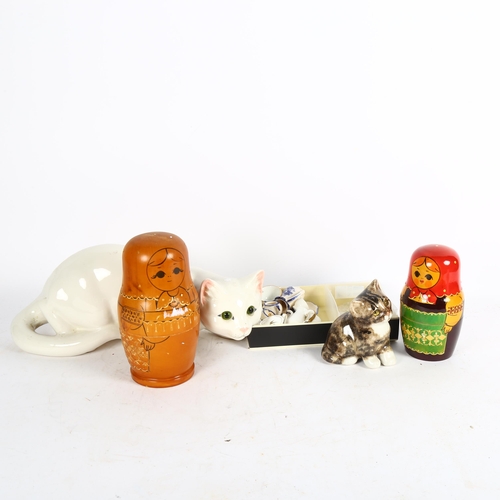 531 - A Winstanley kitten, miniature tea sets, Russian dolls, and a white Just Cats figure