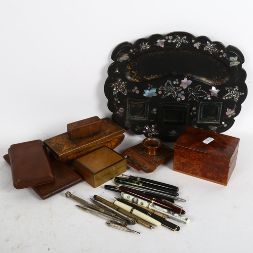 542 - A box of desk items, including copper inkstand, pug work blotter, fountain pens etc