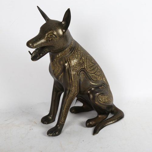 543 - An Egyptian cast-brass jackal with engraved decoration, height 34cm