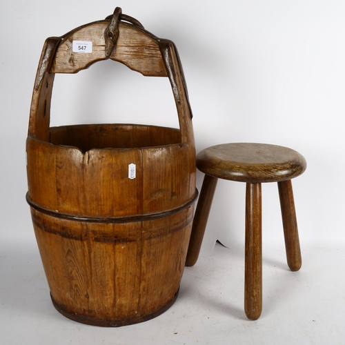 547 - A Chinese wooden rice bucket, height 57cm, and a Vintage 3-legged stool