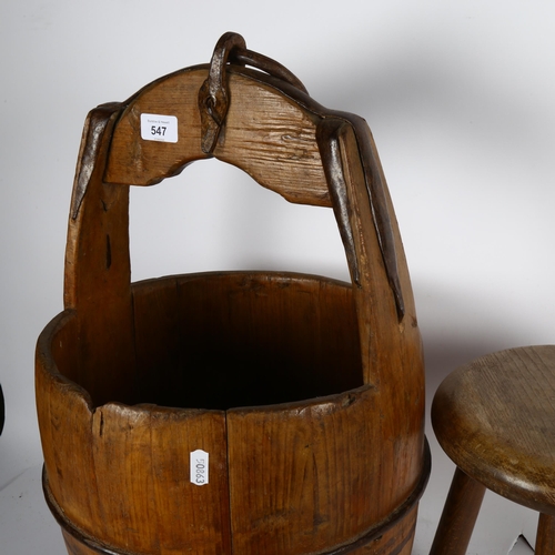 547 - A Chinese wooden rice bucket, height 57cm, and a Vintage 3-legged stool