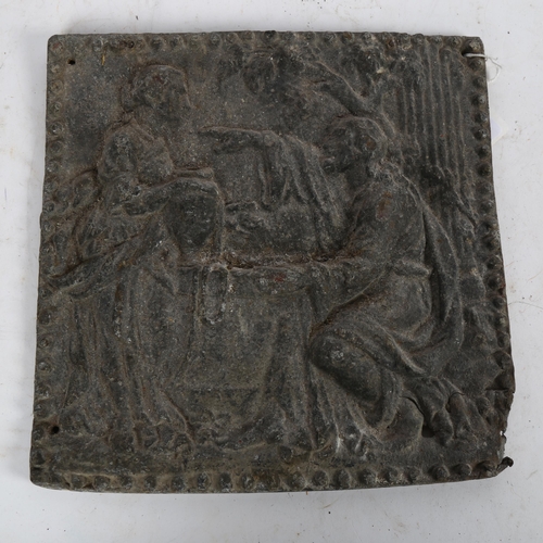 548 - An 18th century relief cast lead wall plaque, depicting figures by a well, 25cm x 25cm