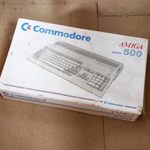 521 - Commodore Amiga Model 500, boxed, keyboard, power pack and instructions