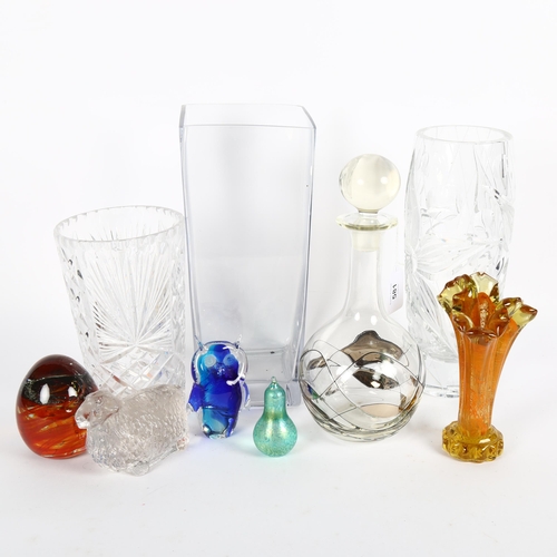 581 - A heavy cut-crystal vase, 28cm, 2 others, a decanter, paperweights etc