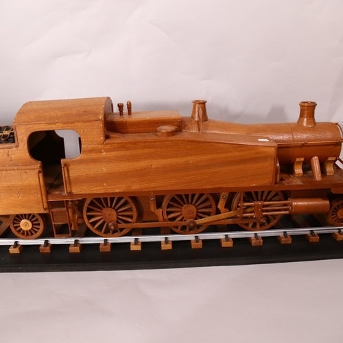 603 - A large scratch-built wooden steam engine and carriage, and 2 sections of track, steam engine length... 