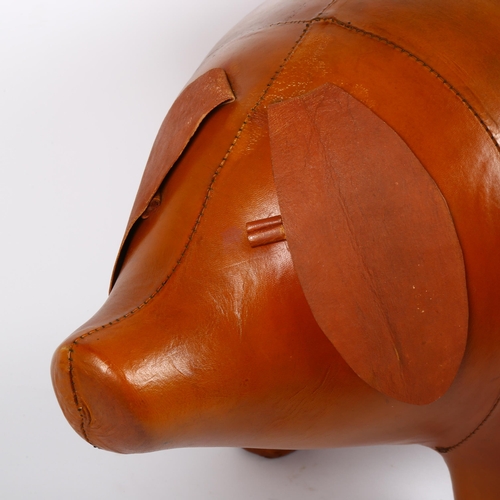 10 - A large tan leather figural pig foot stool, in the manner of Liberty, unmarked, length 70cm