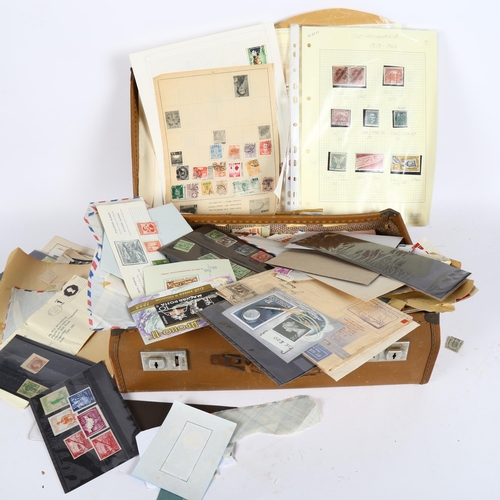 101 - A suitcase full of loose stamps, postcards etc