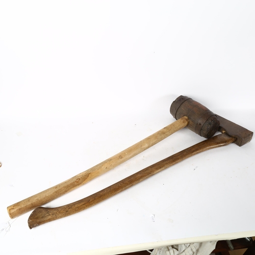 121 - A large Vintage 2-handed mallet, and a hand-forged iron woodsman's lopping axe stamped AL, length 88... 