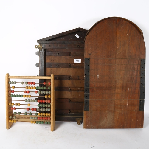 122 - A Vintage Shove Ha'penny board, a cricket score board, and an abacus