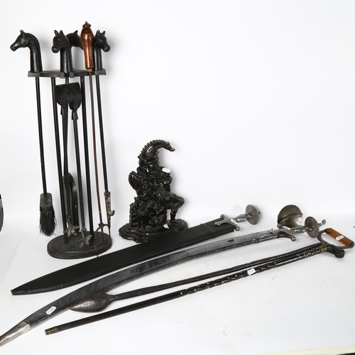 123 - 2 reproduction swords, an ebony and bone walking stick, a Mr Punch doorstop, and a companion set