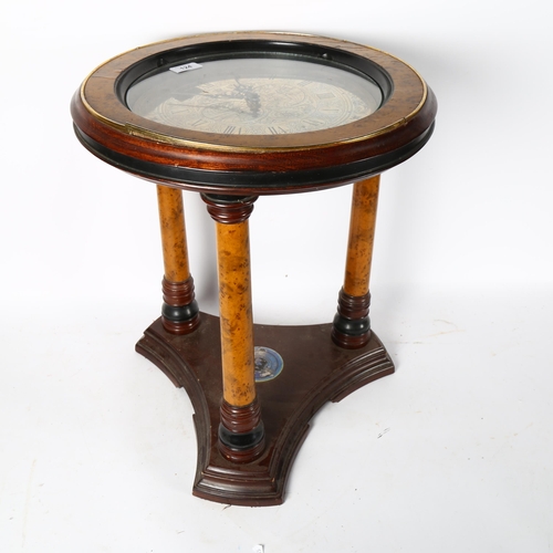 124 - A Franklin Mint Royal Geographical Society circular occasional table, with an inset clock top (quart... 