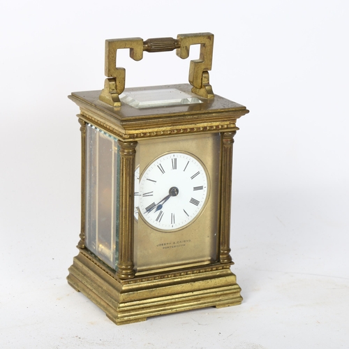 130 - JOSEPH GK & CAIRMS - a brass-cased 8-day carriage clock, with bevelled-glass panels and reeded colum... 