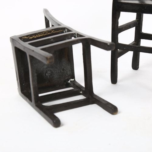 131 - A pair of patinated bronze miniature dining chairs, height 19cm