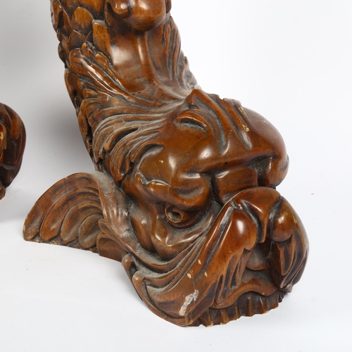 14 - A large pair of carved mahogany dolphin table bases/feet, height 60cm